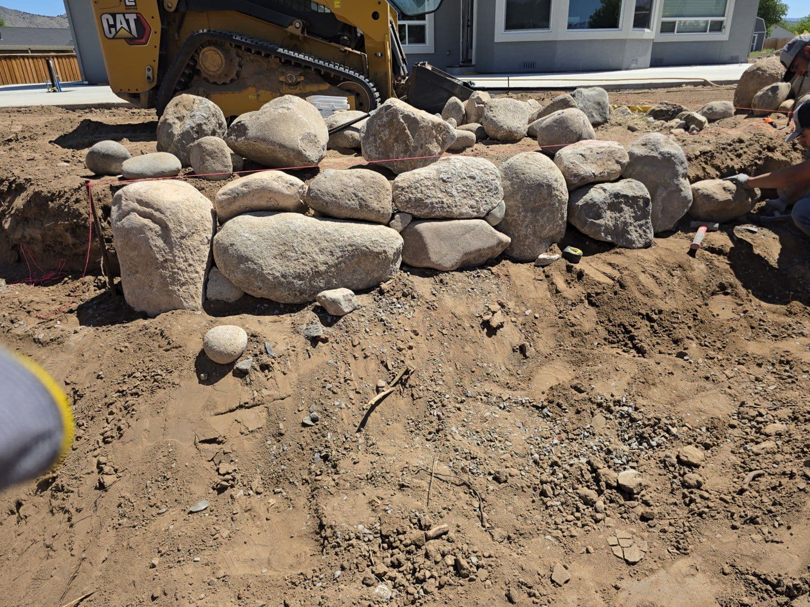 Transforming Backyards with Expert Retaining Wall Installation image